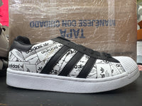 Adidas concha blanco negro periodico