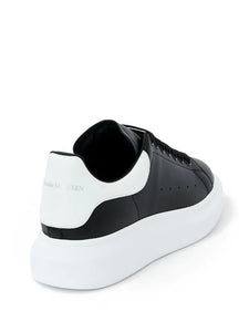 N370O (G5) Alexander McQueen tenis bajos Oversized Negro blanco