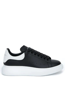 N370O (G5) Alexander McQueen tenis bajos Oversized Negro blanco