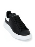 N370O (G5) Alexander McQueen tenis bajos Oversized Negro blanco